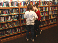 Girls Choosing Titles from the Stacks